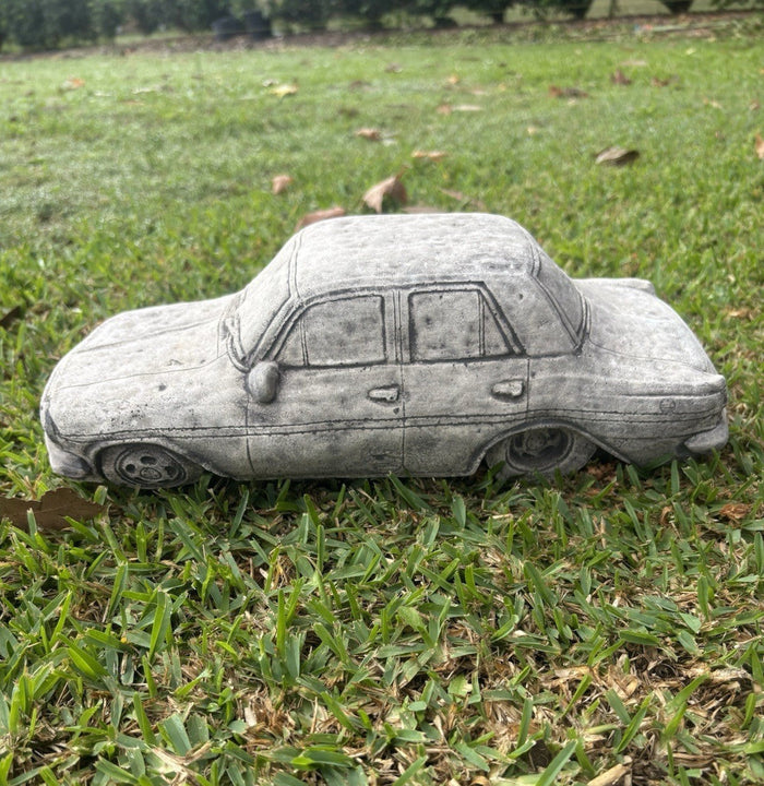 22nice4me Garden Statues concrete 1964 EH car ornament with vintage detailing displayed on a green lawn