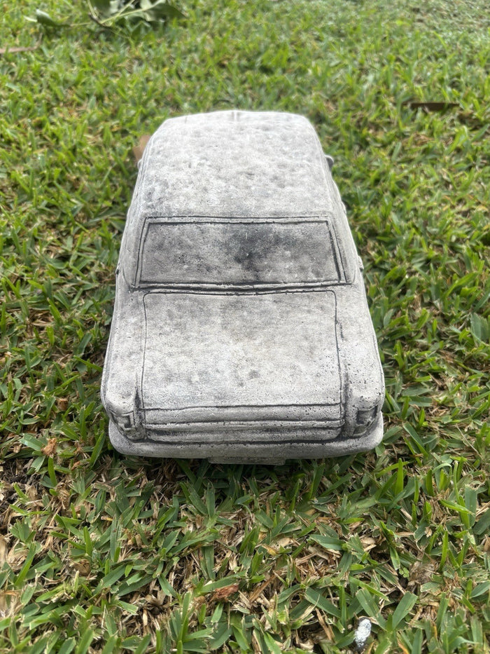 22nice4me Garden Statues concrete 1964 EH car ornament with vintage detailing displayed on a green lawn
