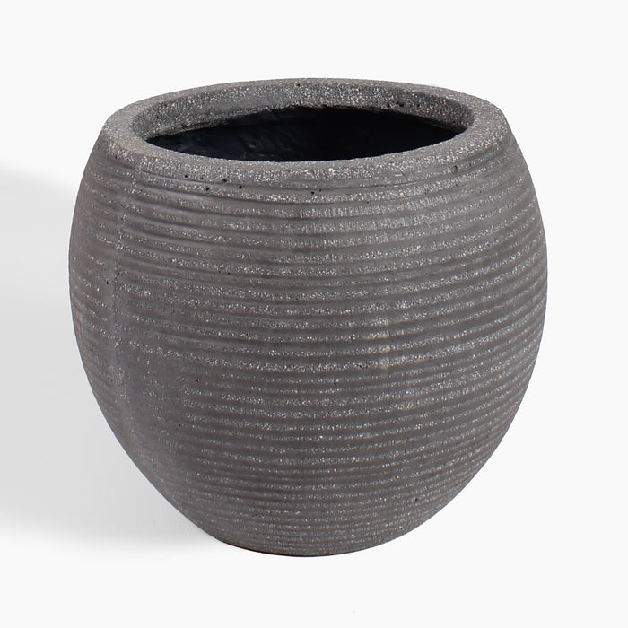 A round, dark gray textured planter pot with horizontal grooved lines and a speckled finish, shown on a clean white background.