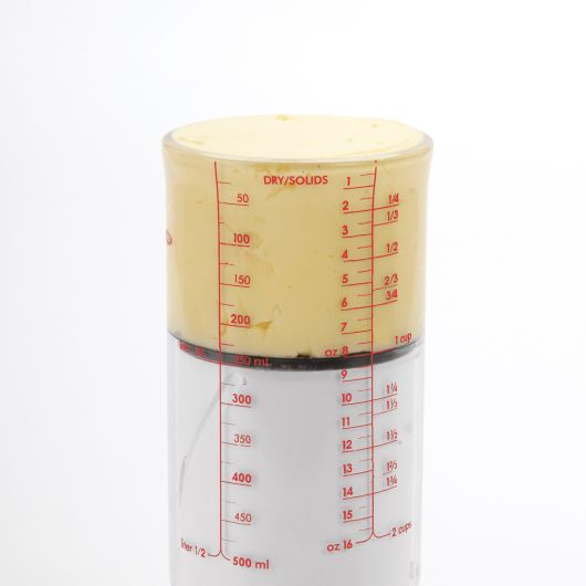 ADJUSTABLE MEASURING CUP