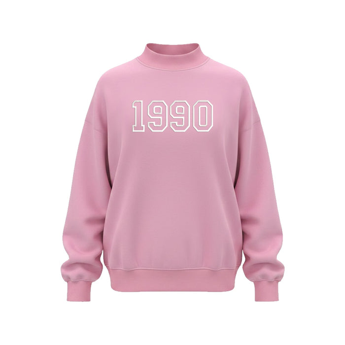 Front view of pink 1990 mock neck sweatshirt with bold white embroidery