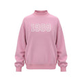 Pink mock neck sweatshirt with white 1989 embroidery on chest