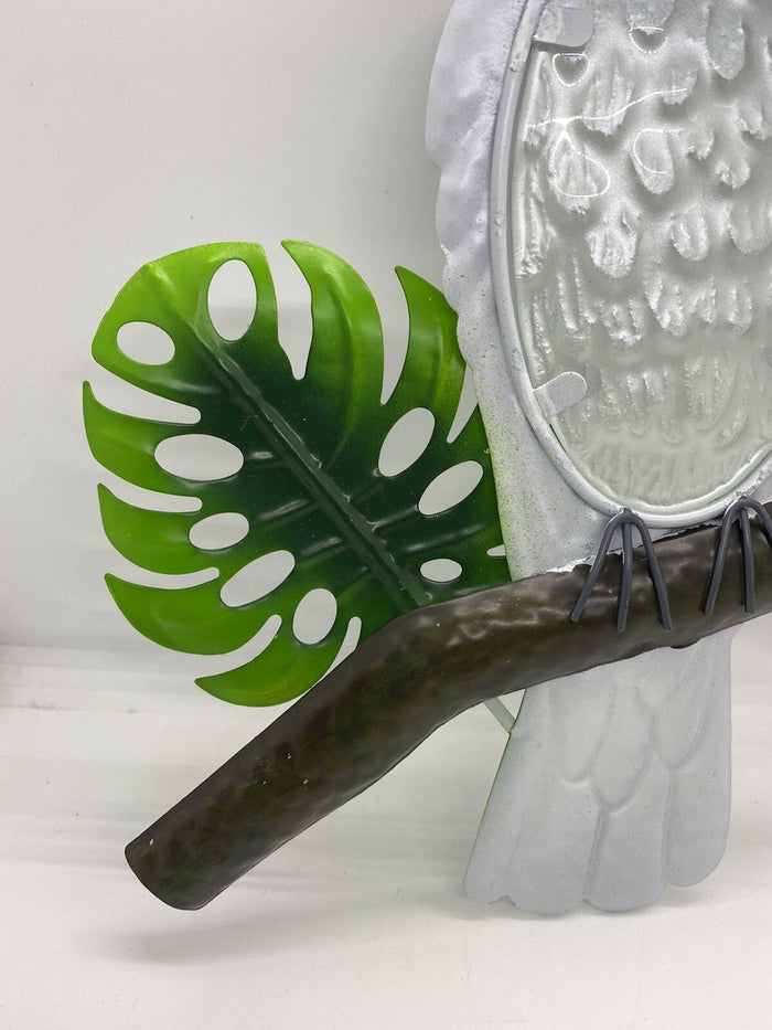 22nice4me Garden Statues metal cockatoo wall art with a green monstera leaf and embossed glass detail on a branch