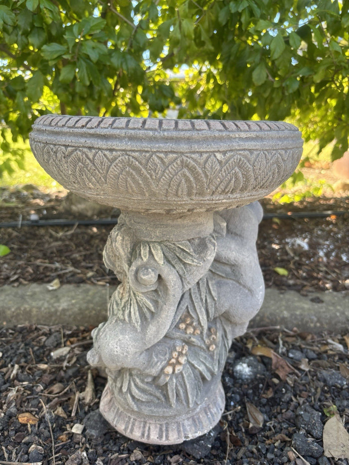 concrete bird bath featuring a detailed Australian possum design in a natural grey finish.