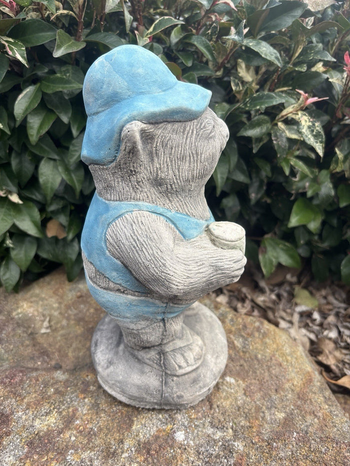 22nice4me Garden Statues concrete wombat wearing a blue cap and vest while holding a beer can in a garden setting