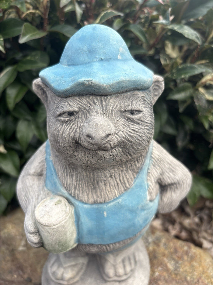 22nice4me Garden Statues concrete wombat wearing a blue hat and overalls while holding a beer can in a garden