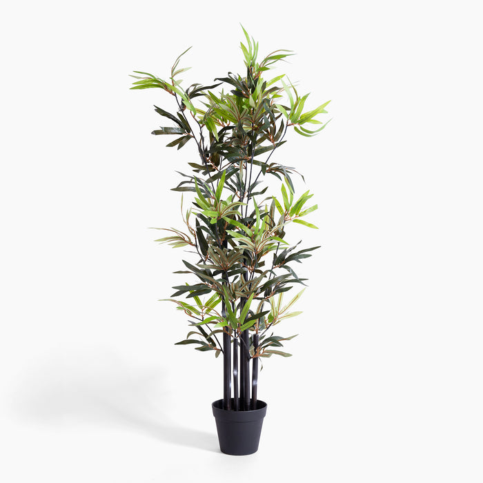 Potted artificial bamboo plant on a white background