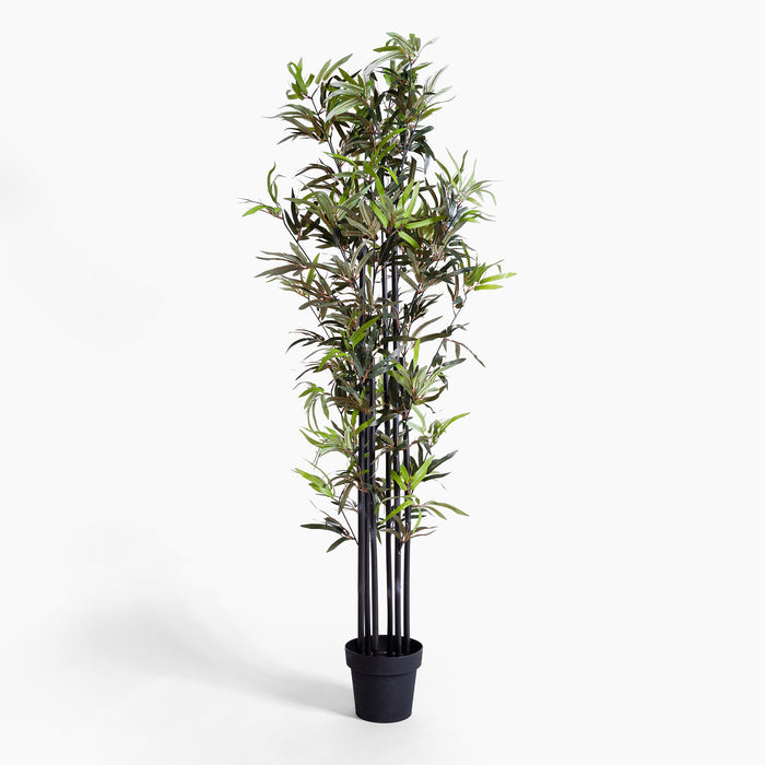 Artificial bamboo plant in a pot on a white background