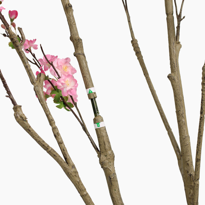 Artificial branches with pink blossom on a white background, showing how to assemble the plant. Arrows show the direction of movement.