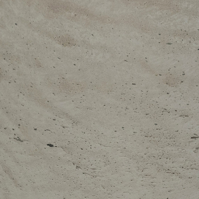 Close-up of a textured beige surface with small variations in color.