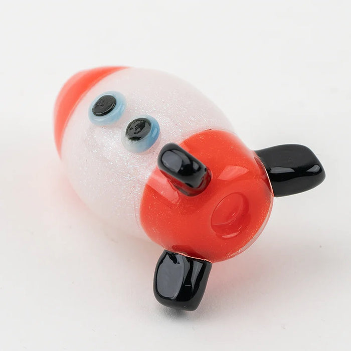 Bottom view of rocket bubble cap on white backdrop highlighting intake hole and three glossy black fins.