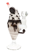 US-made cookies and cream mini rig shaped like a milkshake, with cookie topper, straw mouthpiece, and side joint on a pedestal base.