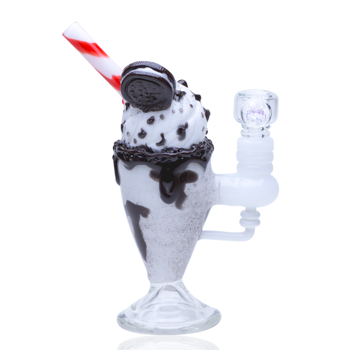 Dessert-themed glass mini rig resembling a chocolate cookie sundae float, compact pedestal base with glass joint and sculpted details.