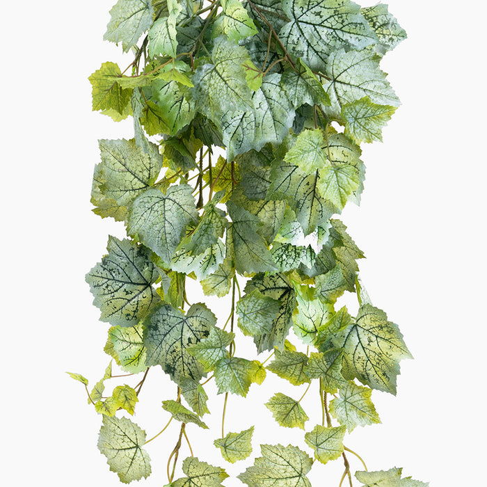 Artificial green leaf garland on a white background