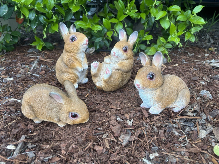 22nice4me Garden Statues set of four hand-painted resin rabbits in various poses on garden mulch