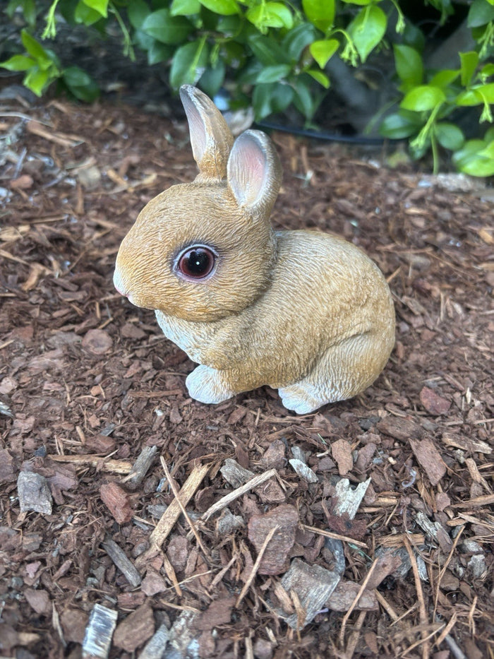 22nice4me Garden Statues hand painted resin rabbit ornament in a natural brown colour sitting on garden mulch