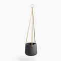 Gray hanging planter with a rope on a white background