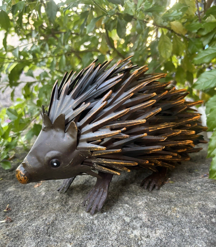 22nice4me Garden Statues handcrafted brown metal echidna with yellow highlights, detailed spikes, and realistic look.