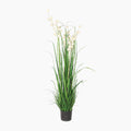 Artificial plant with green leaves and white flowers in a pot on a white background