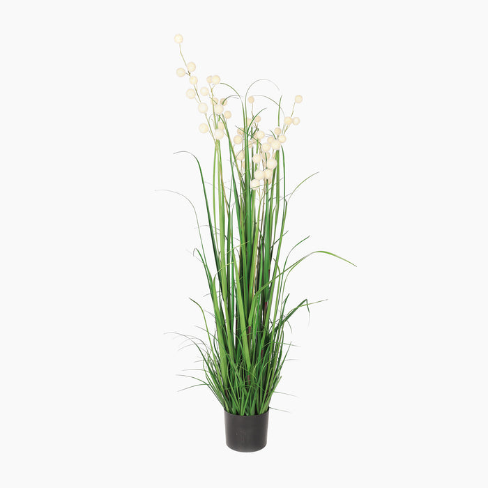 Artificial plant with green leaves and white flowers in a pot on a white background