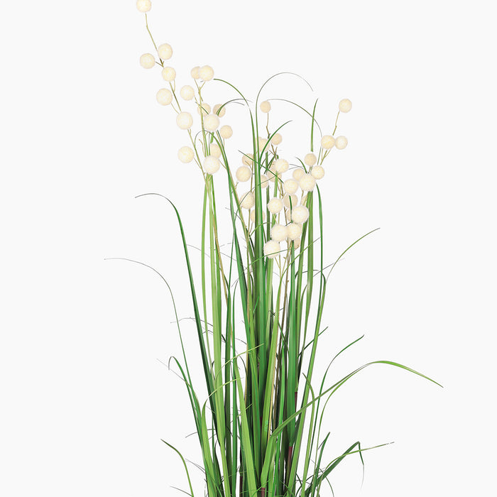Artificial plant with green leaves and white berries on a white background