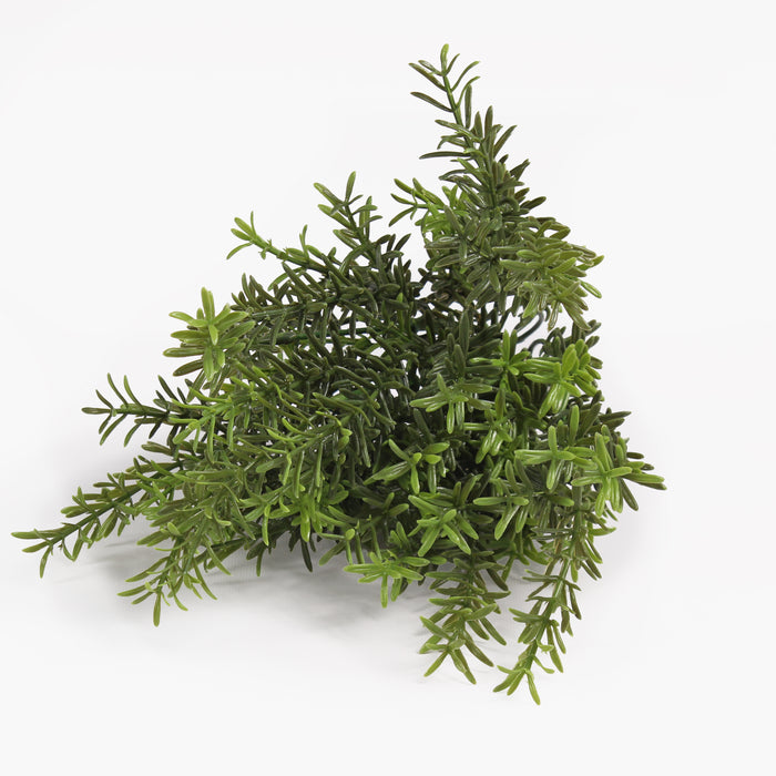 Green artificial pine or cypress-style foliage plant cut into a bush shape, photographed on a clean white studio background.