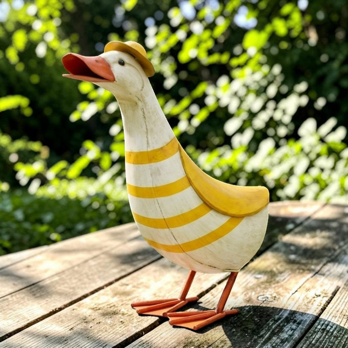 22nice4me Garden Statues metal duck ornament with yellow and white stripes and a small yellow hat in a garden setting