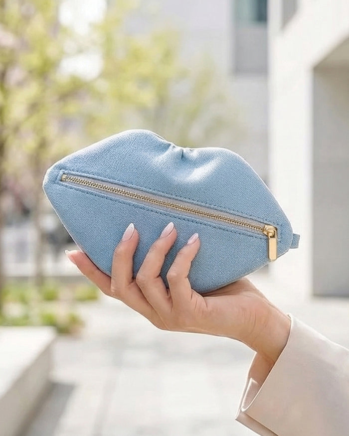 The Blake — Light Blue Denim Lip Pouch by David Stesner ArtHouse — light wash denim red makeup, top-down view