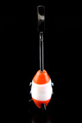 Retro red-and-white rocket glass dab tool with stainless flat scoop tip standing upright on black background, showing four black landing-gear fins and porthole accents.