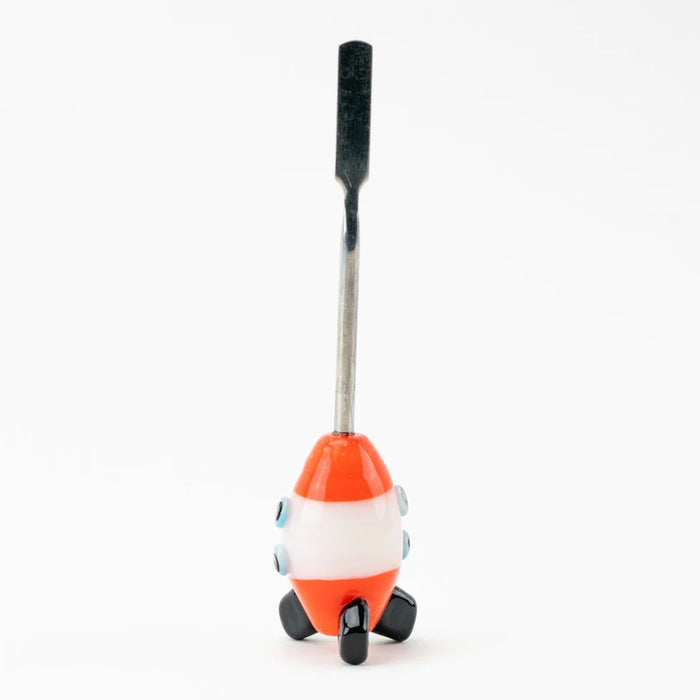 Side profile of rocket dab tool displaying tapered stainless scoop, glossy red nose cone, white mid-band, and textured black fins against white studio background.