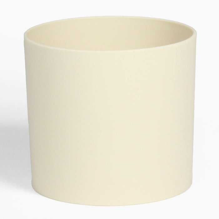 Beige ceramic planter on a white background
