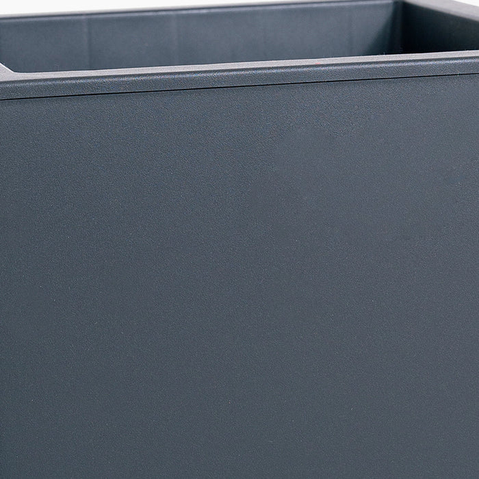 Close-up of a dark gray rectangular planter with a smooth surface.