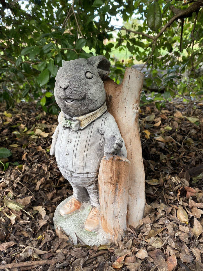 22nice4me Garden Statues Willow Father Rabbit concrete garden ornament wearing a cardigan and pants in a garden setting