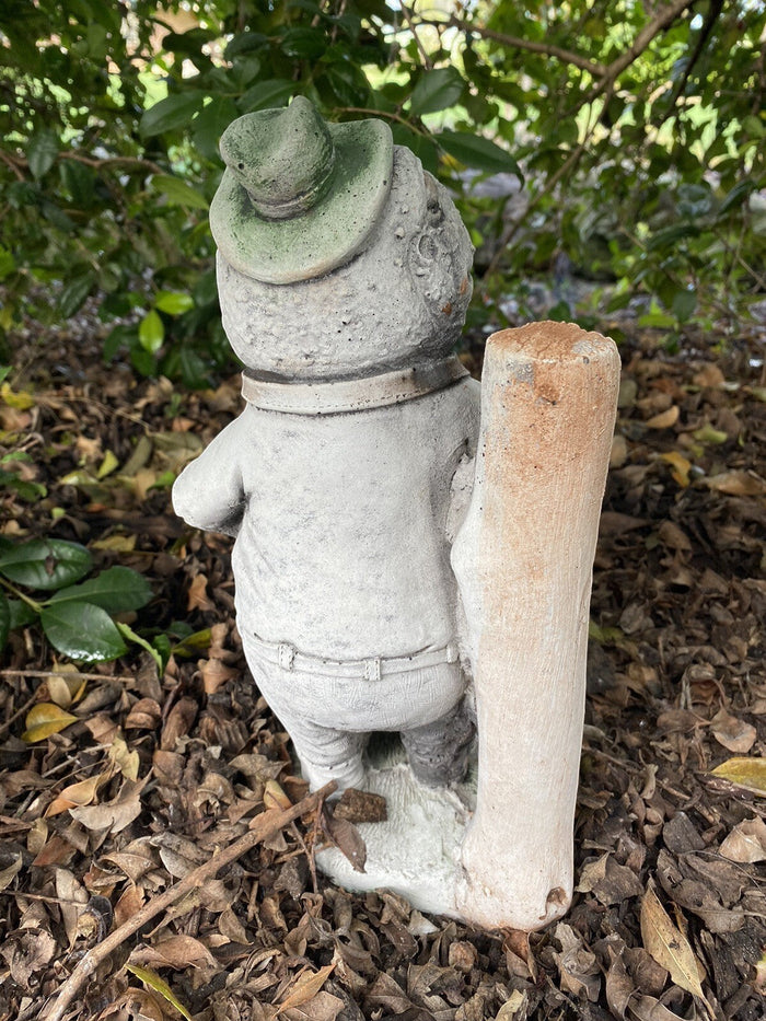 22nice4me Garden Statues Willow frog Mr Fisher concrete garden ornament with green hat, back view in garden setting